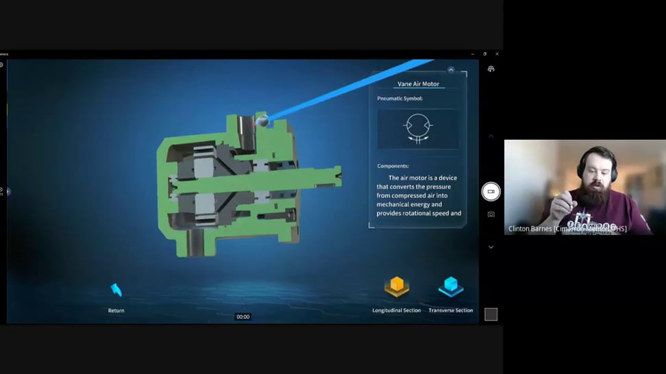 Screenshot of a zSpace virtual reality session showcasing a detailed 3D model of a Vane Air Motor. The model, accompanied by a pneumatic symbol and description explaining its function in converting compressed air into mechanical energy, provides an interactive learning experience. An instructor visible in a video call on the right side of the screen guides the session, highlighting the educational capabilities of zSpace's AR technology.